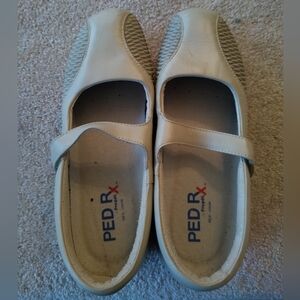 This is a pair of Women's Propet Erika Mary Jane shoes in the bone color.